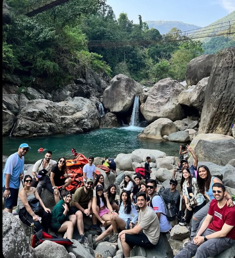 Bali adventure group beside a jungle waterfall
