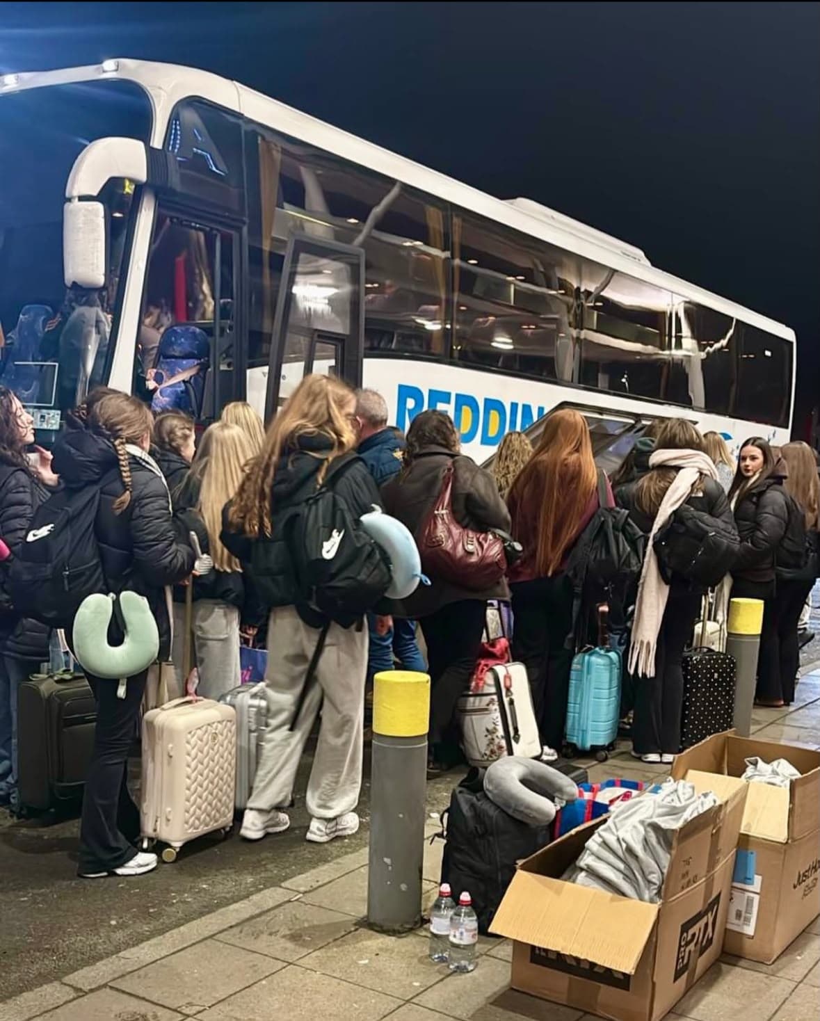 Travel group beginning their coach journey
