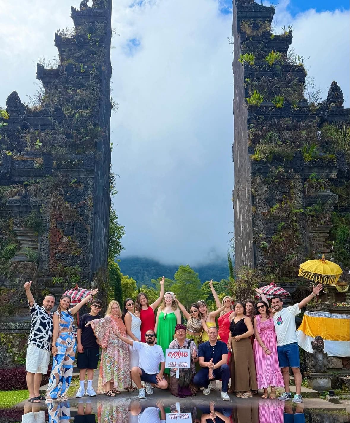 Travelers together at an iconic Bali gate